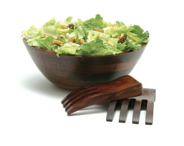 the salad bowl and salad hands on a white background