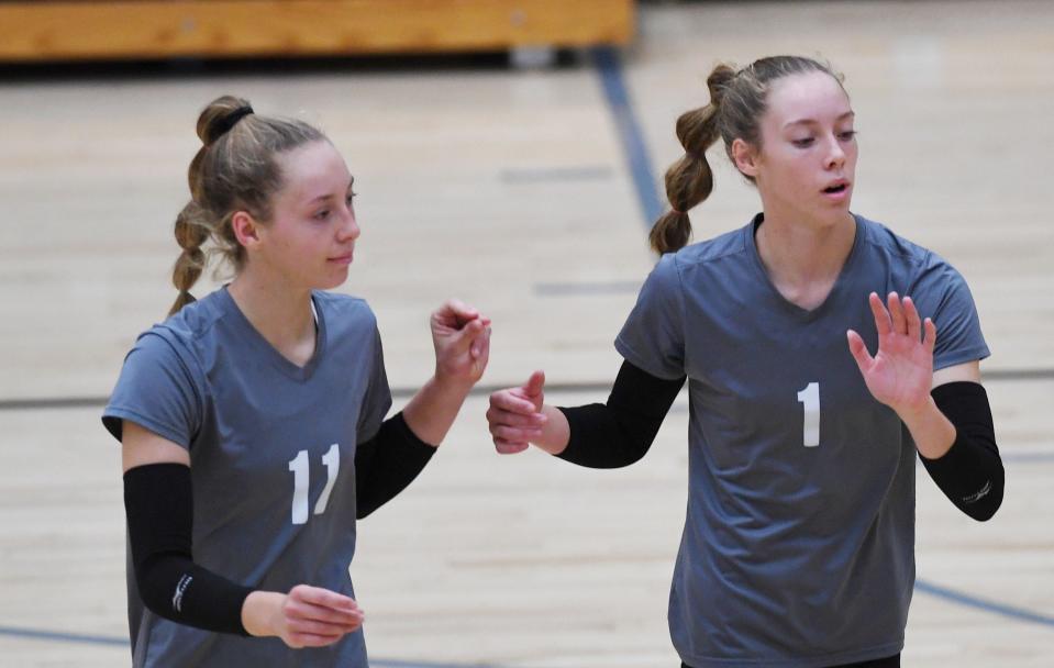 Eddyville-Blakesburg-Fremont's twin sisters Kate and Molly Shafer react to a point at the Southeast Polk Invitational on Sept. 10 in Pleasant Hill.