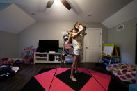 Cecilia Shaffette picks up her sister Lydia in their home in Carriere, Miss., Wednesday, June 16, 2021. (AP Photo/Gerald Herbert)