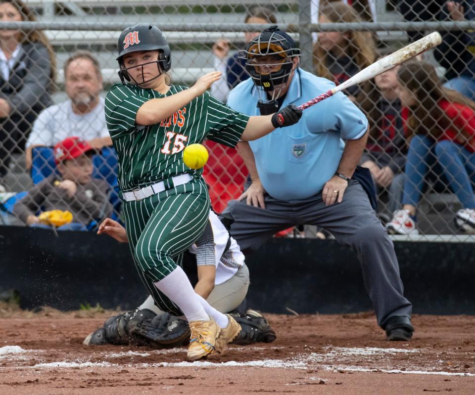 Dolphin Gracie Lewis follows through after making contact. Mosley and Rutherford faced off in the first round of the Bay County tourney at Bozeman High School Wednesday, March 23, 2022.