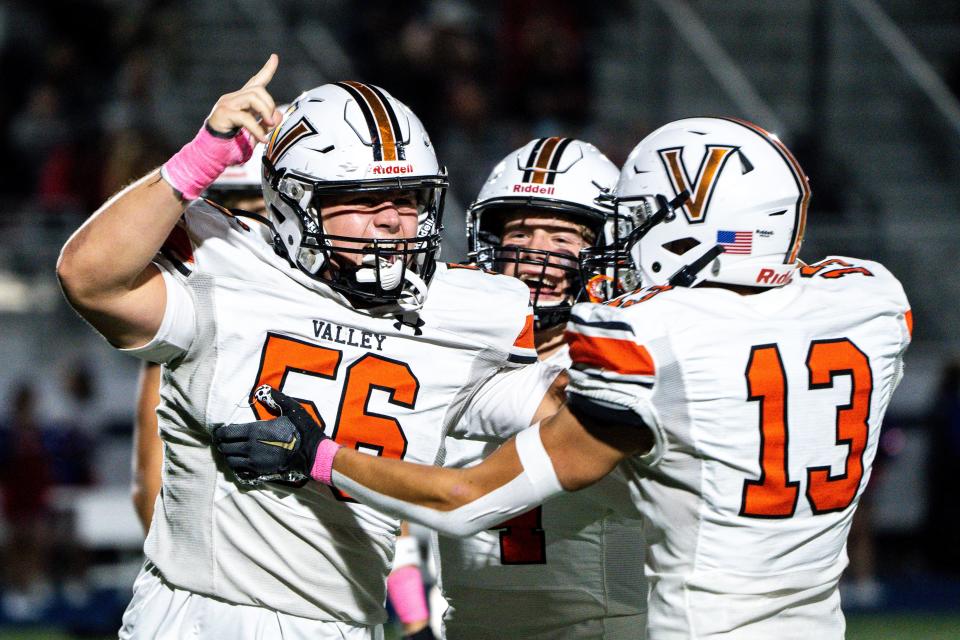 West Des Moines Valley's Ryan Stinson (56) celebrates after recovering a fumble at Marshalltown on Friday. Valley won the Week 9 matchup, 42-18.