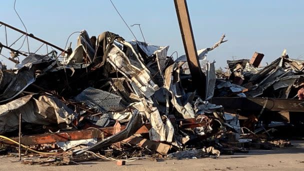 PHOTO: Debris from a tornado covers a damaged structure, March 25, 2023, in Rolling Fork, Miss. (Rogelio Solis/AP)