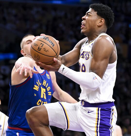 LOS ANGELES, CA - MAY 20: Los Angeles Lakers forward Rui Hachimura, right, goes up for a shot,