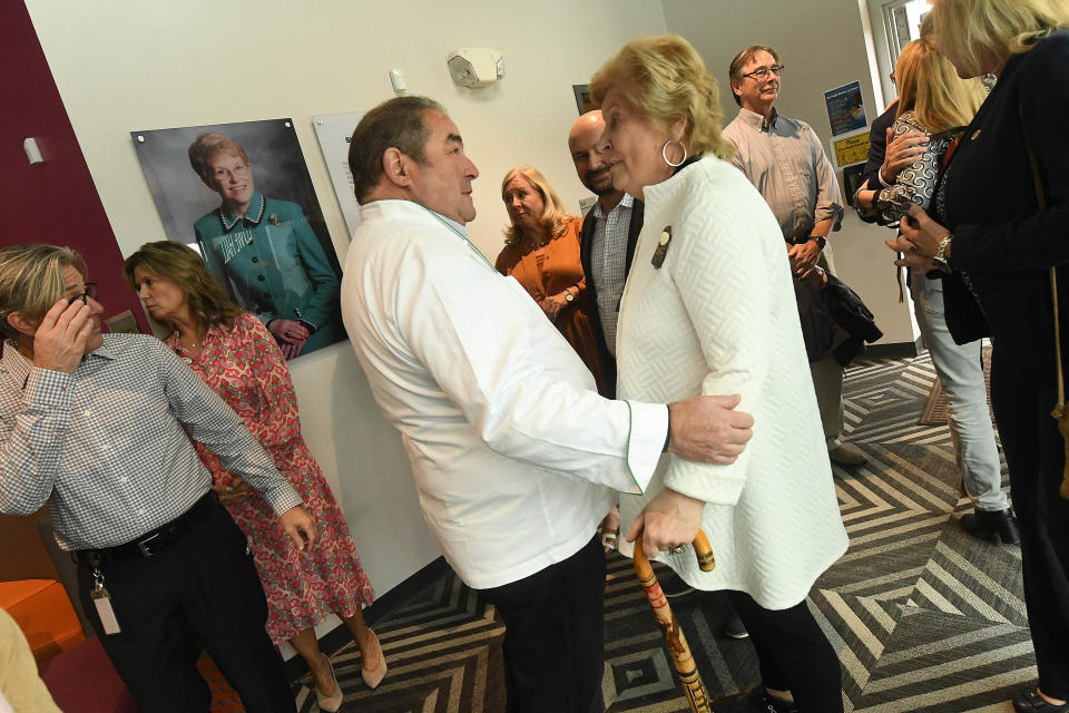 Emeril Lagasse talks with Judy Girard, GLOW Academy founder, as they visit the school on Thursday. The Emeril Lagasse Foundation granted the Girls Leadership Academy of Wilmington $500,000 to support the school’s culinary classroom and curriculum.