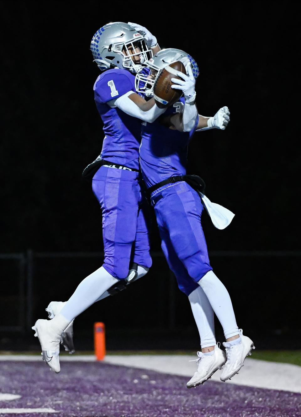 Bloomington South’s D’Andre Black (1) celebrates with Lucas Waldon after a touchdown during the IHSAA regional football game against Evansville North at South on Friday, Nov. 10, 2023.