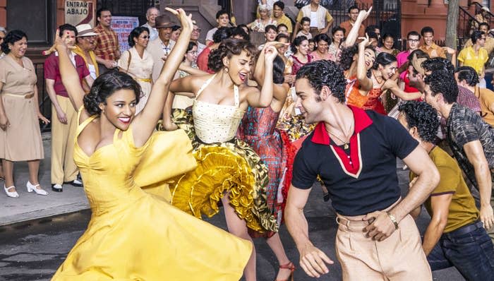 Ariana DeBose and David Alvarez dance in the street