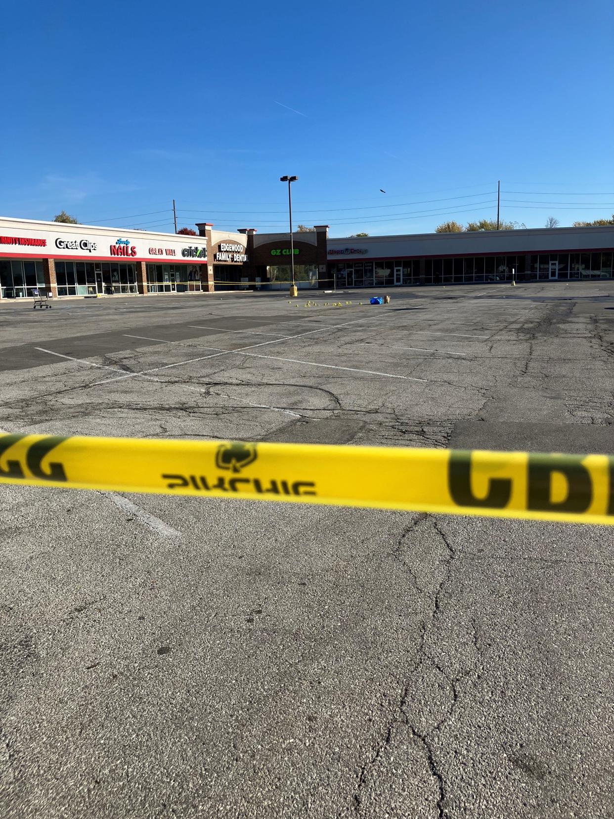 A pick-up truck is towed from a mall at 5900 Madison Ave. on the south side of Indianapolis following a mass shooting that left one person dead and five injured outside GZ Restaurant and Karaoke.