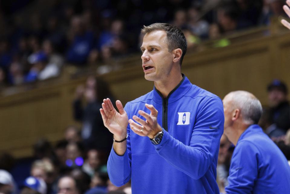 Duke head coach Jon Scheyer claps for his team during the first half of an NCAA college basketball exhibition game against UNC Pembroke in Durham, N.C., Wednesday, Nov. 1, 2023. (AP Photo/Ben McKeown)