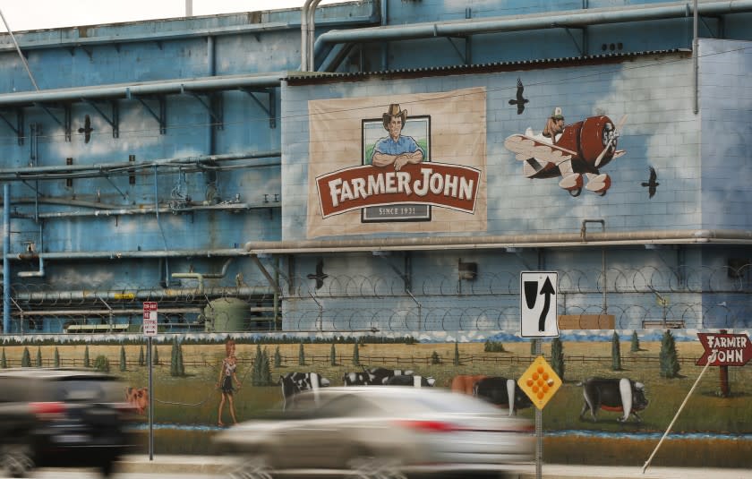 VERNON, CA - NOVEMBER 3, 2017: Farmer John located at Soto St and E. 37th Street in Vernon Friday November 3, 2017 as air quality officials are expected to adopt new rules aimed at easing foul odors from animal rendering plants. Nearby Boyle Heights residents have long complained for about stomach-churning odors wafting over from five Vernon-area rendering plants, which take animal parts from slaughterhouses and cook them down into fats and proteins that are used to make pet food, fertilizer, cosmetics and products. The new standards, which took over three years for regulators to develop amid pushback from the industry, will require facilities enclose some of their outdoor animal processing operations, use odor-control equipment and take other steps to minimize offensive odors. (Al Seib / Los Angeles Times)