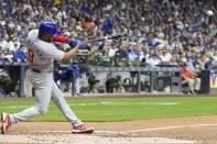 Chicago Cubs' Jeimer Candelario hits a single during the third inning of a baseball game against the Milwaukee Brewers Saturday, Sept. 30, 2023, in Milwaukee. (AP Photo/Morry Gash)