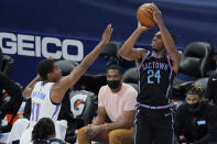 Sacramento Kings guard Buddy Hield (24) shoots over Oklahoma City Thunder guard Theo Maledon (11) in the first half of an NBA basketball game Tuesday, May 4, 2021, in Oklahoma City. (AP Photo/Sue Ogrocki)