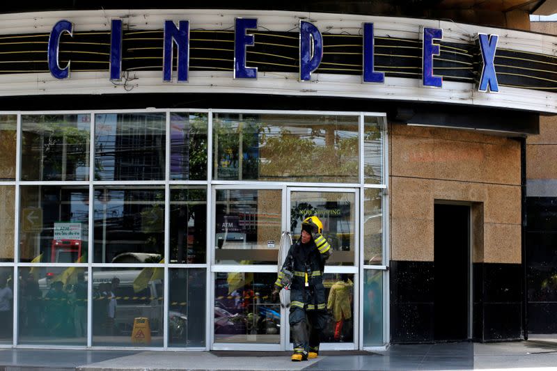 FILE PHOTO: A firefighter walks out from the Major Cineplex theatre in Bangkok