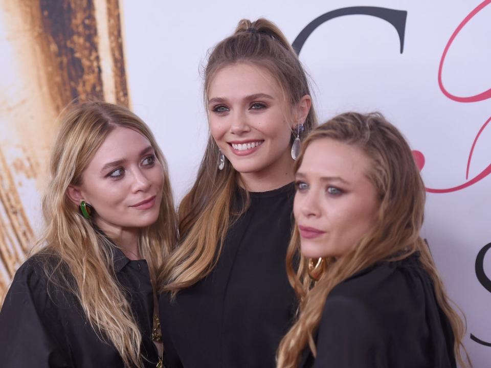 ‘I could only benefit from their healthy perspective’: Olsen with her sisters Mary-Kate and Ashley (Getty)