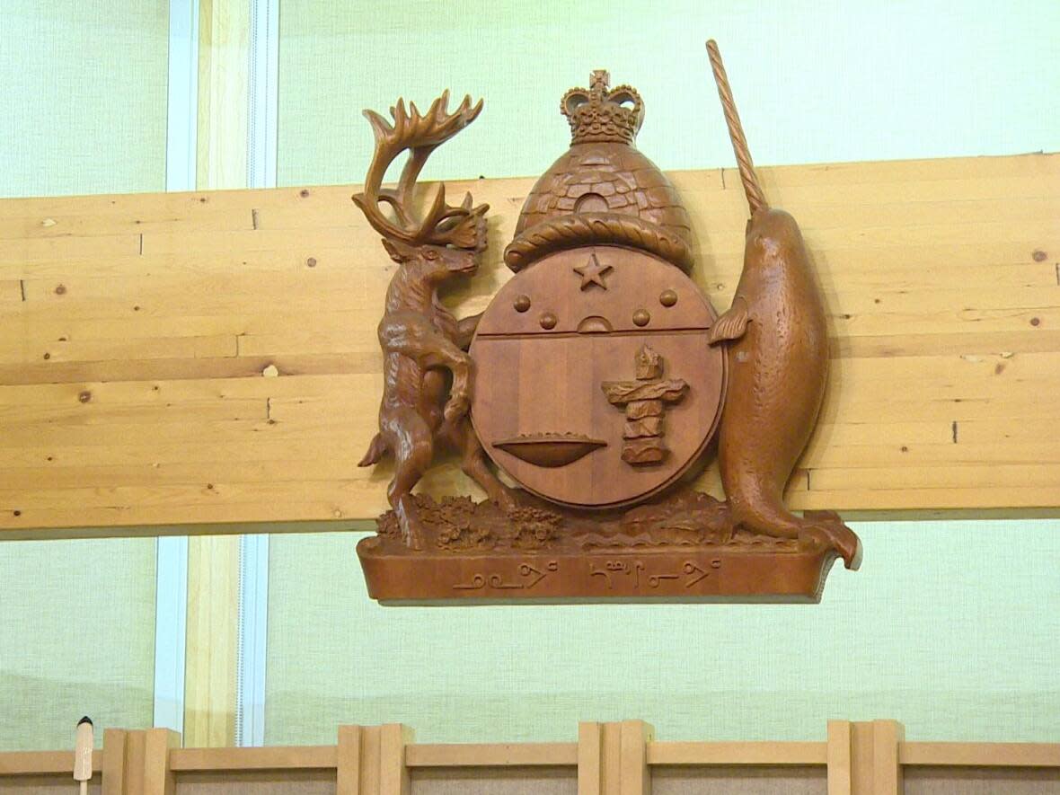 The coat of arms of Nunavut located in the legislative chamber in Iqaluit, pictured on Dec. 29, 2021. Because a key position in the Nunavut government is vacant, thousands of traditional place names that have been used for generations in Nunavut, won't be made official any time soon. (Steve Silva/CBC - image credit)