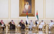 In this photo released by Saudi Press Agency, Saudi Crown Prince Mohammed bin Salman, third left, offers condolences to Sheikh Mohamed bin Zayed Al Nahyan, president of the UAE and ruler of Abu Dhabi, third, right, on the passing of Sheikh Khalifa bin Zayed Al Nahyan, the late president of the UAE, at the Presidential Airport in Abu Dhabi, UAE, Monday, May 16, 2022. (Saudi Press Agency via AP)