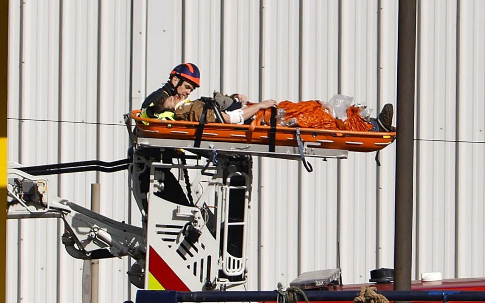 An injured person on a stretcher is helped by emergency services - Jeff J Mitchell/Getty Images