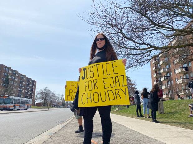 People demonstrated in Mississauga in response to a new report released by Ontario's police watchdog that cleared Peel Regional Police officers of any wrongdoing in the killing of Ejaz Choudry last summer.  (Jessica Ng/CBC - image credit)