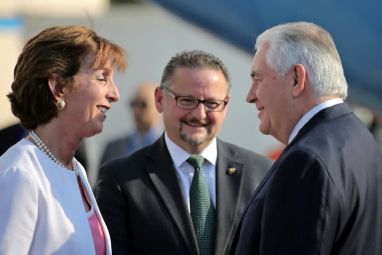 US Secretary of State Rex Tillerson (R) is welcomed by US Ambassador Roberta Jacobson (L), and Mauricio Ibarra director of North American affairs at the Mexican foreign affairs ministry as he arrivesin Mexico City on February 22, 2017