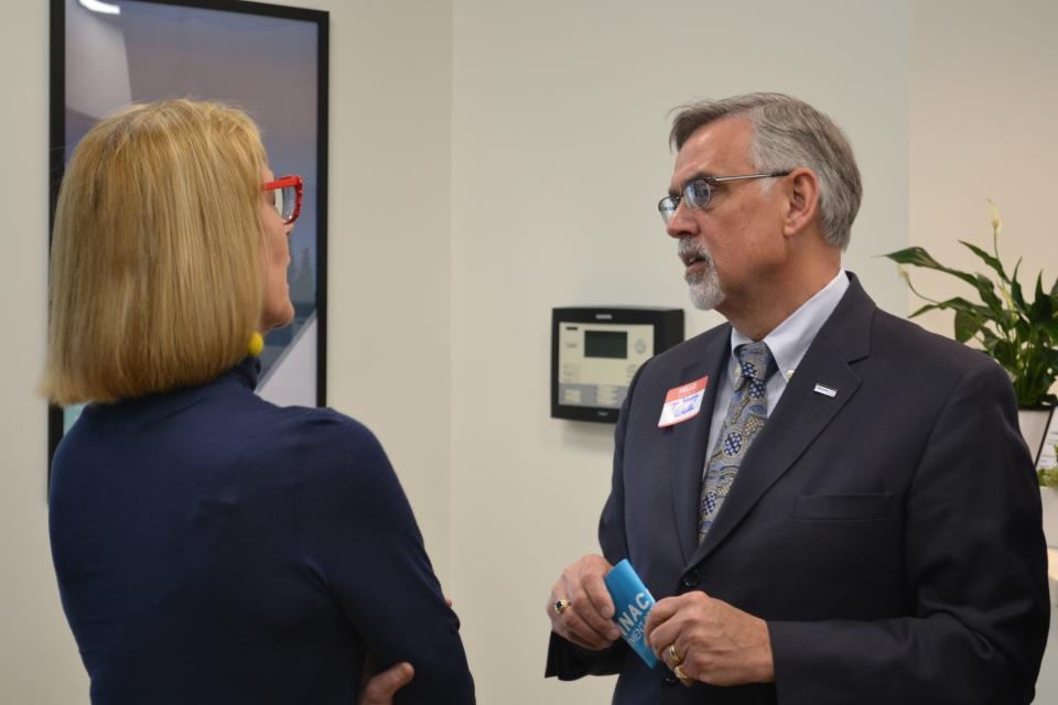 Indiana Lt. Gov. Suzanne Crouch, left, talks with Martinsville Mayor Kenny Costin at a ribbon cutting for Recovery Works Martinsville, a 64-bed drug treatment center.