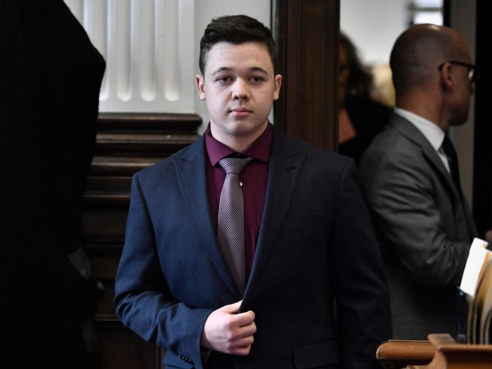 Kyle Rittenhouse enters the courtroom to hear the verdicts in his trial at the Kenosha County Courthouse in Kenosha, Wis., on Friday, Nov. 19, 2021.