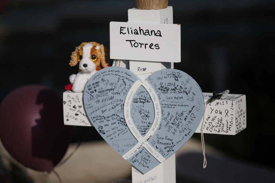 CORRECTS SPELLING OF FIRST NAME TO ELIAHNA, NOT ELIAHANA - Eliahna Torres' cross stands at a memorial site for the victims killed in this week's shooting at Robb Elementary School in Uvalde, Texas, Friday, May 27, 2022. (AP Photo/Dario Lopez-Mills)