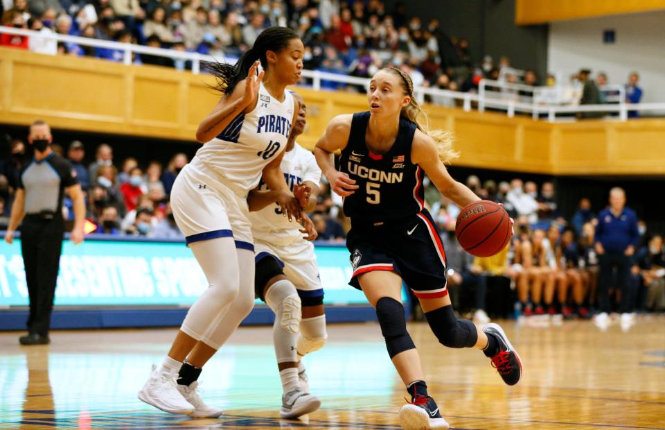 UConn guard Paige Bueckers (5) drives to the basket against Seton Hall forward Mya Bembry (10) during the Huskies' win Friday in South Orange, N.J.
