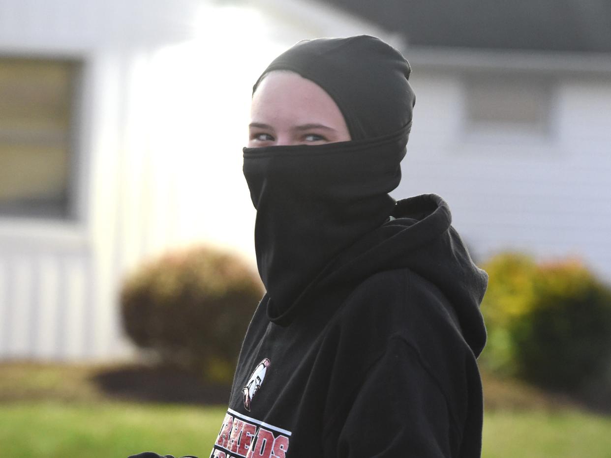 A cold, windy day at Riverheads High School meant extra layers for Summer Wallace during track practice.