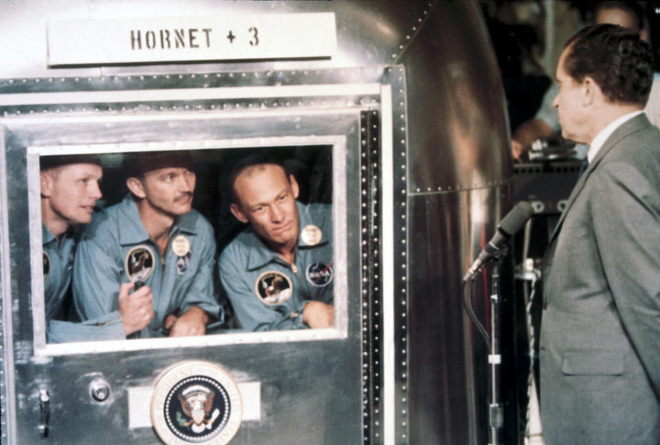 UNITED STATES - MAY 21:  Astronauts, Neil Armstrong, Edwin �Buzz� Aldrin and Michael Collins are welcomed aboard the USS Hornet by President Richard Nixon. The astronauts are in a Mobile Quarantine Facility. Apollo 11, the first manned lunar landing mission, was launched on 16th July 1969 and Neil Armstrong and Aldrin became the first and second men to walk on the Moon on 20th July 1969. Command Module pilot Michael Collins remained in lunar orbit while Armstrong and Aldrin were on the surface. The astronauts returned to Earth on 24th July 1969.  (Photo by SSPL/Getty Images)