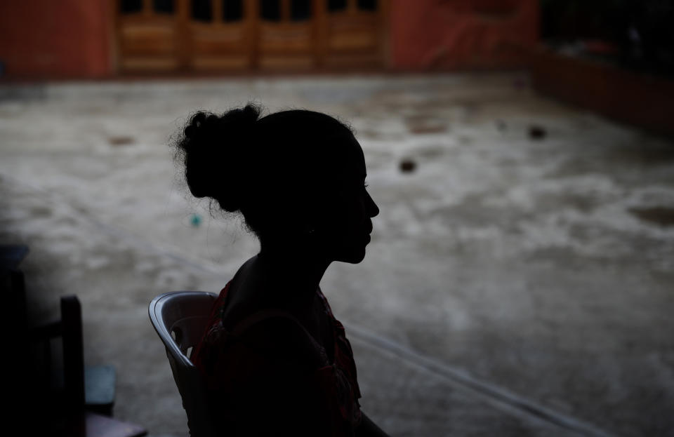 In this May 28, 2019 photo, a Honduran migrant woman who did not want to be identified, talks about her experience being detained at the Siglo XXI migrant detention center, in Tapachula, Chiapas state, Mexico. The woman said that she was locked up for two weeks with her 2-year-old daughter at the detention center. (AP Photo/Marco Ugarte)