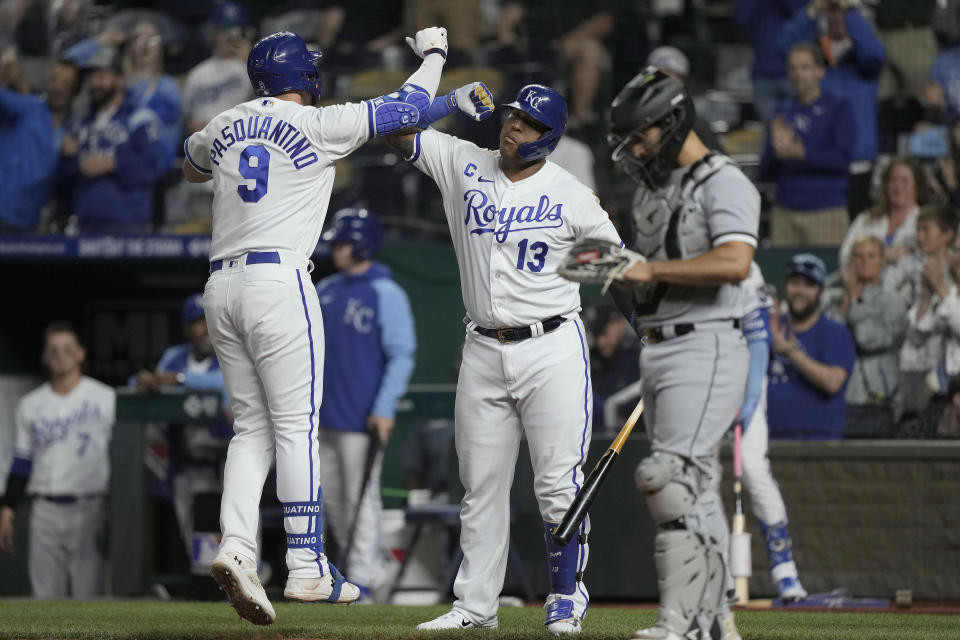Kansas City Royals' Vinnie Pasquantino (9) celebrates with Kansas City Royals' Salvador Perez (13) after hitting a solo home run during the first inning of a baseball game against the Chicago White Sox Tuesday, May 9, 2023, in Kansas City, Mo. (AP Photo/Charlie Riedel)