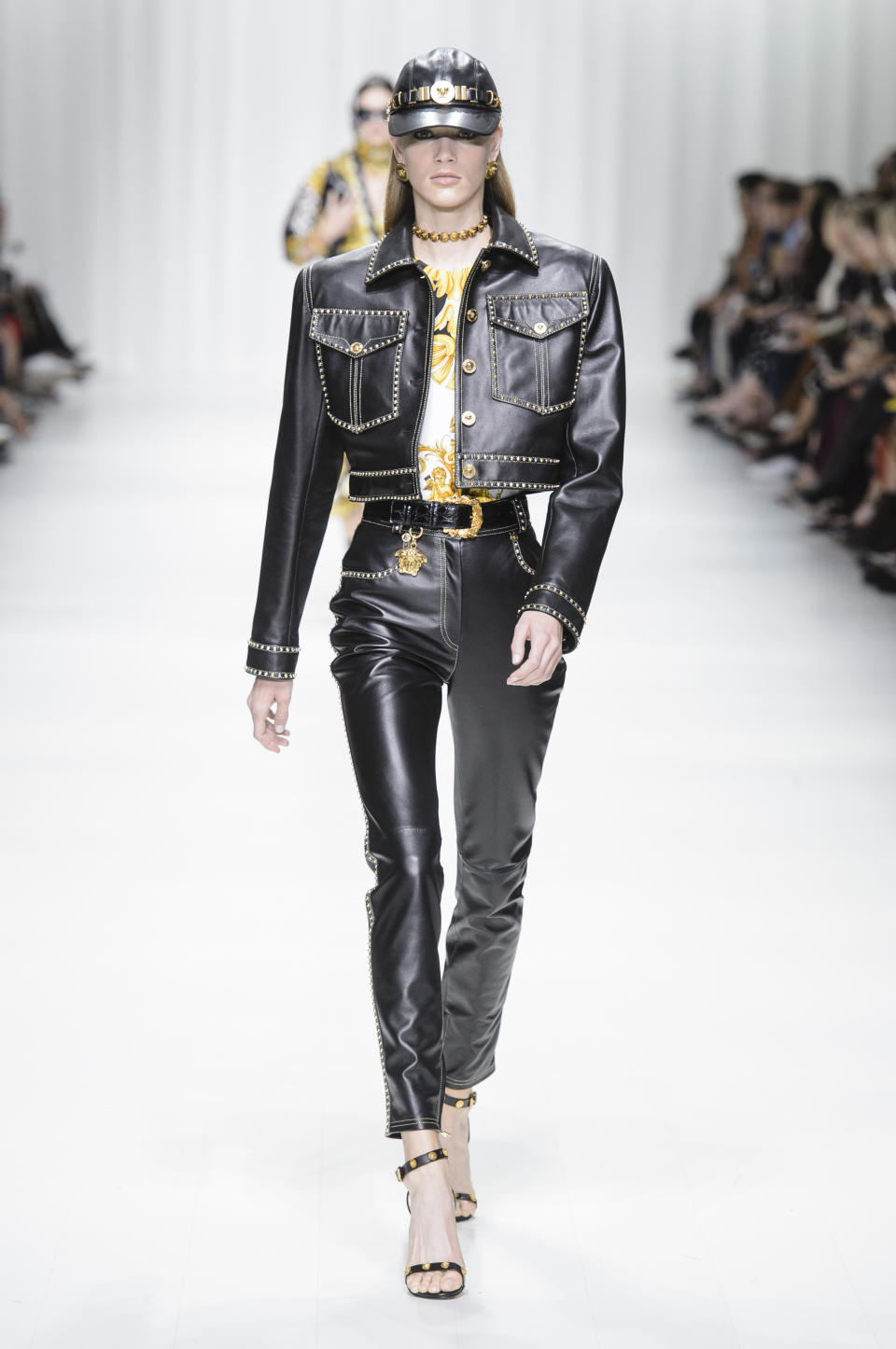 <p><i>A leather cap, jacket, and trousers came from the SS18 Versace collection. (Photo: ImaxTree) </i></p>