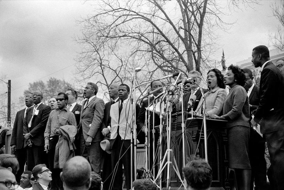 <span class="caption">Civil rights and Union leaders sing ‘We Shall Overcome’ at the conclusion of the Selma to Montgomery civil rights march on March 25, 1965 in Montgomery, Alabama.</span> <span class="attribution"><a class="link " href="https://www.gettyimages.com/detail/news-photo/dr-civil-rights-and-union-leaders-sing-we-shall-overcome-at-news-photo/507992160?adppopup=true" rel="nofollow noopener" target="_blank" data-ylk="slk:Stephen F. Somerstein/Getty Images;elm:context_link;itc:0;sec:content-canvas">Stephen F. Somerstein/Getty Images</a></span>