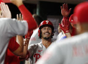 Philadelphia Phillies Garrett Stubbs celebrates his three-run home run against the Cincinnati Reds with his teammates during the ninth inning of a baseball game in Cincinnati Tuesday, Aug. 16, 2022. The Phillies won 11-4. (AP Photo/Paul Vernon)