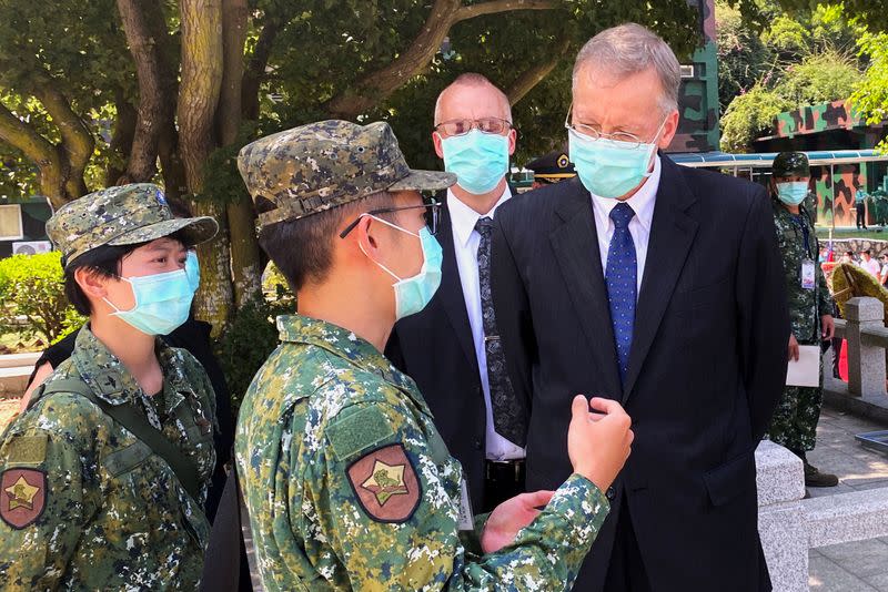 Brent Christensen, director of the American Institute in Taiwan talks to soldiers after attending an event to mark the 62nd anniversary of the Second Taiwan Strait crisis in Kinmen