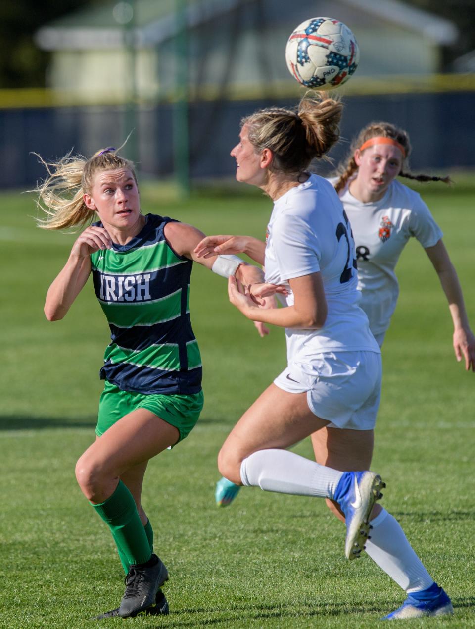 Peoria Notre Dame's Mya Wardle defends against Normal Community's Lindsey Leverton in the first period Thursday, April 13, 2023 at PND High School. The Irish blanked the Ironmen 2-0.