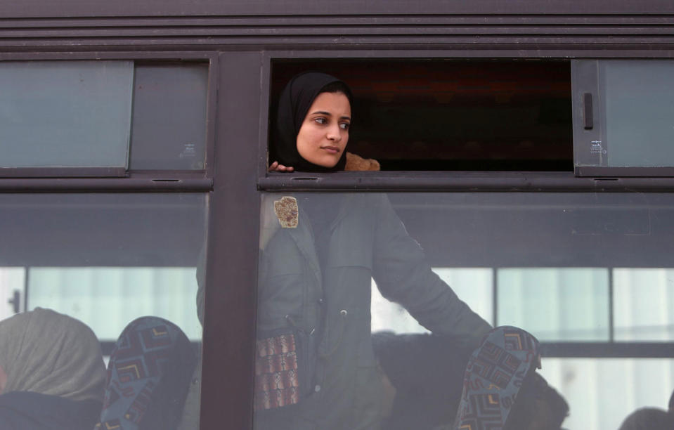 <p>A girl looks out of a bus window as she waits to cross into Egypt through the Rafah border crossing after it was opened by Egyptian authorities for humanitarian cases, in the southern Gaza Strip Feb. 7, 2018. (Photo: Ibraheem Abu Mustafa/Reuters) </p>