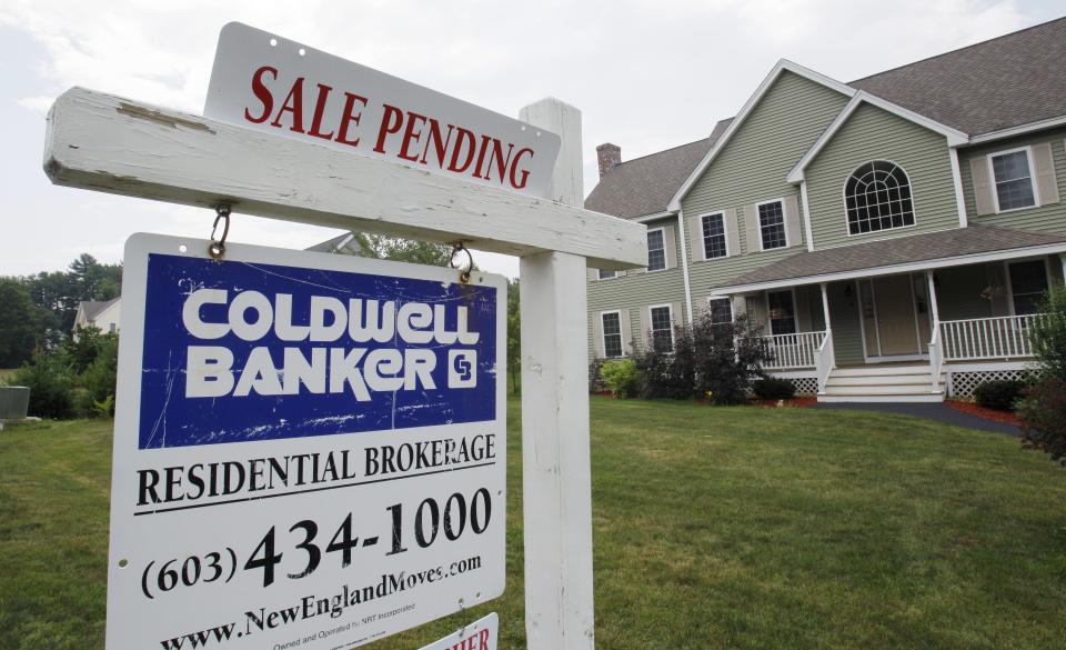 In this photo taken June 28, 2010, a sale pending banner is posted on a real estate sign in Londonderry, N.H. The number of buyers who signed contracts to purchase homes dropped in May to the lowest level on record, a sign the housing recovery can't survive without government incentives.(AP Photo/Charles Krupa)