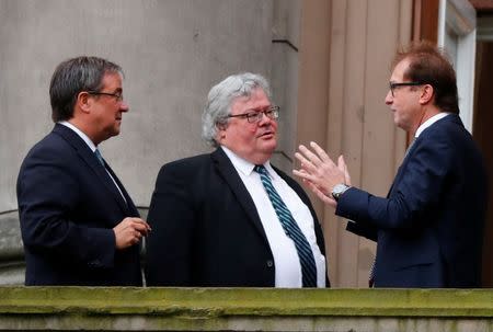 (L-R) Armin Laschet of Christian Democratic Union (CDU), Reinhard Buetikofer of the Green Party and Alexander Dobrindt of Christian Social Union (CSU) are seen on a balcony of German Parliamentary Society offices before the exploratory talks about forming a new coalition government held by CDU/CSU in Berlin, Germany, October 26, 2017. REUTERS/Fabrizio Bensch