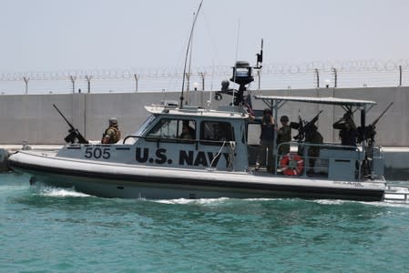 U.S. Navy Fifth Fleet escorts journalists to the Japanese-owned Kokuka Courageous tanker, at a U.S. NAVCENT facility near the port of Fujairah, United Arab Emirates