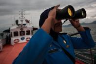 A personnel of Indonesia's National Search and Rescue during a search for missing Malaysian Airlines flight MH370 on March 17, 2014