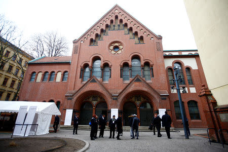 People are seen ouside a Rykestrasse Synagogue, in Berlin, Germany, November 9, 2018. REUTERS/Fabrizio Bensch