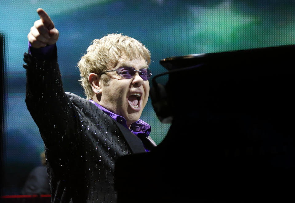 FILE - This June 30, 2012 file photo shows British pop star Elton John performing during the Euro 2012 soccer championship in Kiev, Ukraine. Elton John has canceled a show in London’s Hyde Park after being diagnosed with appendicitis that will require surgery. A statement issued Tuesday July 9, 2013 by the musician's publicist said John was suffering from an inflamed appendix and surrounding abscess. The 66-year-old performer had been due to play an outdoor concert in London's Hyde Park on Friday on a bill with Elvis Costello and Ray Davies.(AP Photo/Efrem Lukatsky, file)