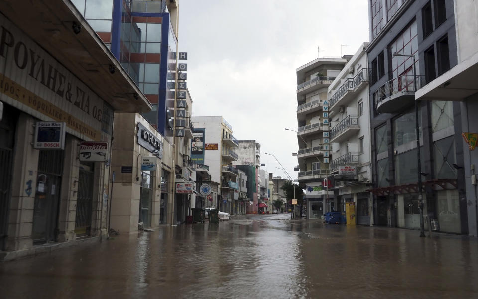 Water covers a main street after a rainstorm in Volos, central Greece, Wednesday, Sept. 6, 2023. The death toll from severe rainstorms that lashed parts of Greece, Turkey and Bulgaria increased Wednesday after rescue teams located the body of a missing vacation who was swept away by flood waters that raged through a campsite in northwest Turkey. (AP Photo/Thodoris Nikolaou)