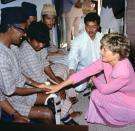 <p>Diana (comforting a patient in Nepal in 1993) "could genuinely show her affection," says Anwar. "It came naturally to her, but she also knew which pictures would go around the world."</p>