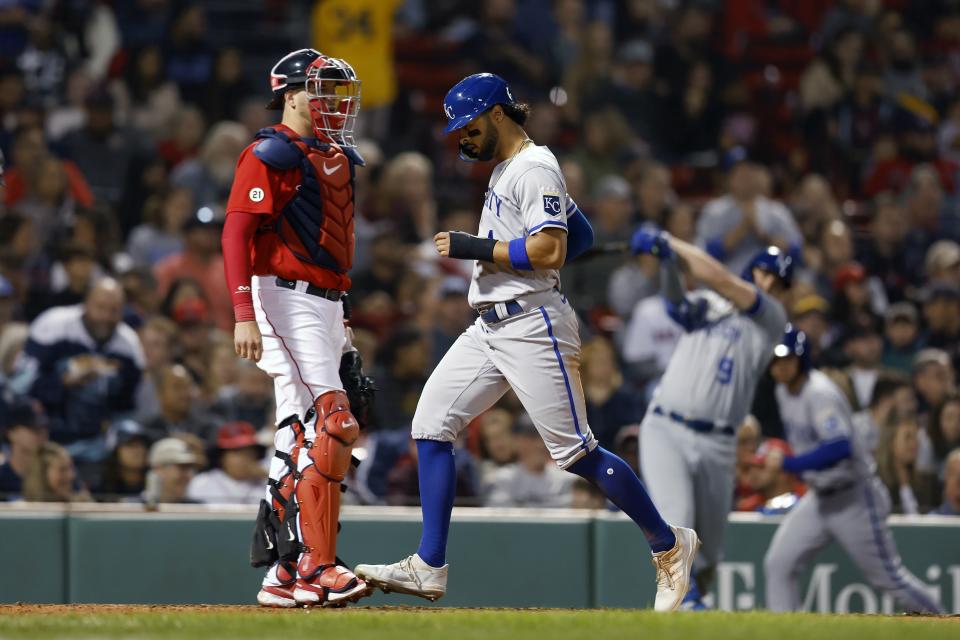Kansas City Royals' MJ Melendez, center, scores in front of Boston Red Sox's Kevin Plawecki, left, on an RBI single by Salvador Perez during the sixth inning of a baseball game Friday, Sept. 16, 2022, in Boston. (AP Photo/Michael Dwyer)