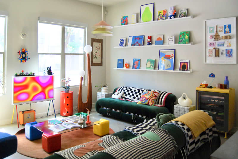 Tchotchkes on shelves in eclectic living room.