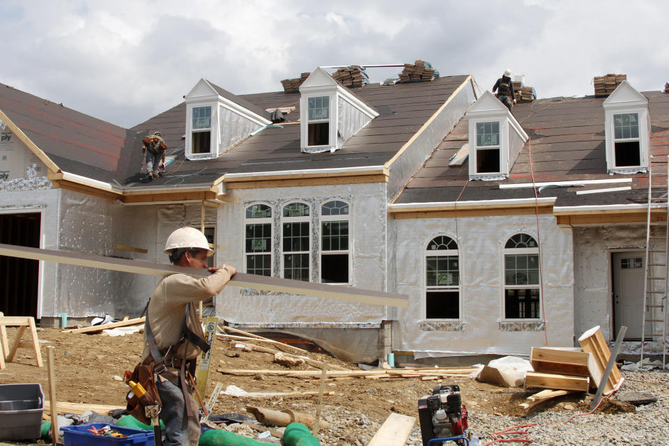 This May 2, 2012, photo, shows a new homes under construction in Bridgeville, Pa. A surge in homebuilding pushed U.S. construction spending up by the largest amount in five months, the latest indication that the housing sector is slowly recovering. Construction spending rose 0.9 percent in May, following a 0.6 percent rise in April, the Commerce Department reported Monday, July 2, 2012. It was the biggest percentage gain since December.  (AP Photo/Gene J. Puskar)