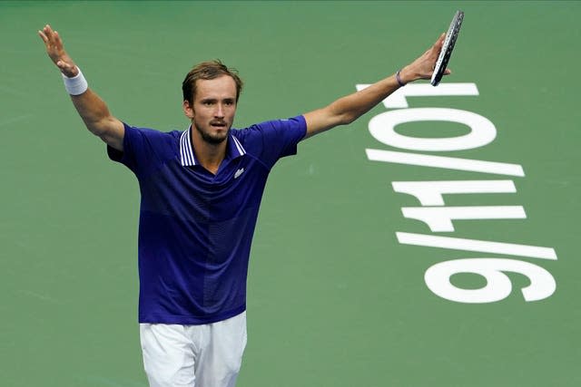 Daniil Medvedev raises his arms to the crowd