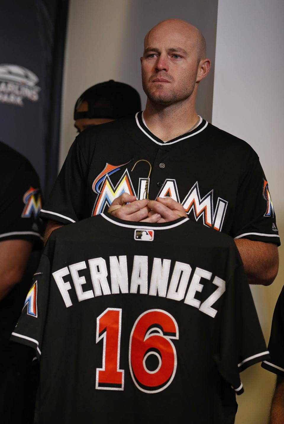 <p>Miami Marlins pitcher Mike Dunn holds a Jose Fernandez jersey during a press conference after Fernanedez died in a boating accident. Play was cancelled between the Marlins and the Atlanta Braves on September 25, 2016 in Miami, Florida. (Photo by Joe Skipper/Getty Images) </p>