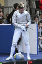 Ukraine's Olga Kharlan leaves after her bout with Russia's Anna Smirnova in the women's individual sabre best of 64 round match, during the FIE World Fencing Championship, in Milan, Italy, Thursday, July 27, 2023. Olympic champion Kharlan competed against officially-neutral Russian opponent Smirnova at the world fencing championships, an Olympic qualifier, on Thursday in Milan, Italy, winning their bout 15-7. However, Smirnova refused to leave after the bout in an apparent protest because Kharlan refused to shake hands at the end. (Tibor Illyes/MTI via AP)